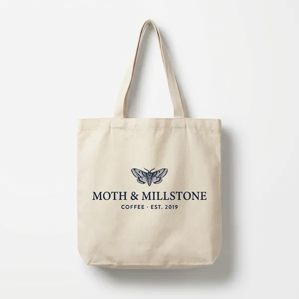 Reference 2: a canvas tote bag printed with a moth and the words Moth & Millstone, Coffee, Est. 2019.
