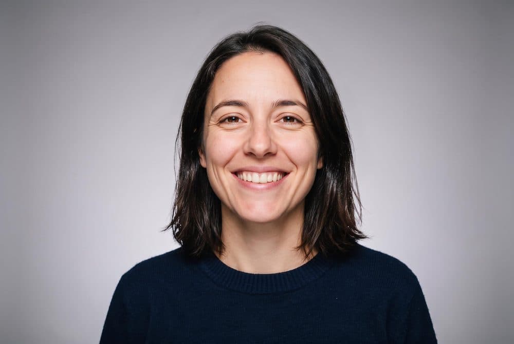 The edited headshot on a studio grey backdrop